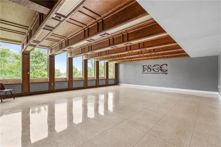 Beamed hall with a wall of windows